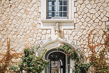 A stone building with a window and a door