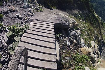 a bike wheel going over a north shore section