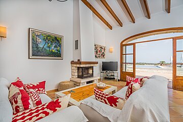 A living room with a fireplace and a television