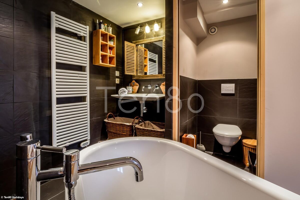 A bathroom with the word terroo on the wall