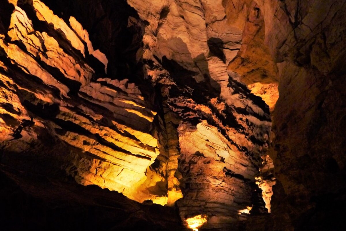 rocks lit up within the gouffre de padirac