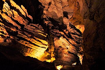 rocks lit up within the gouffre de padirac