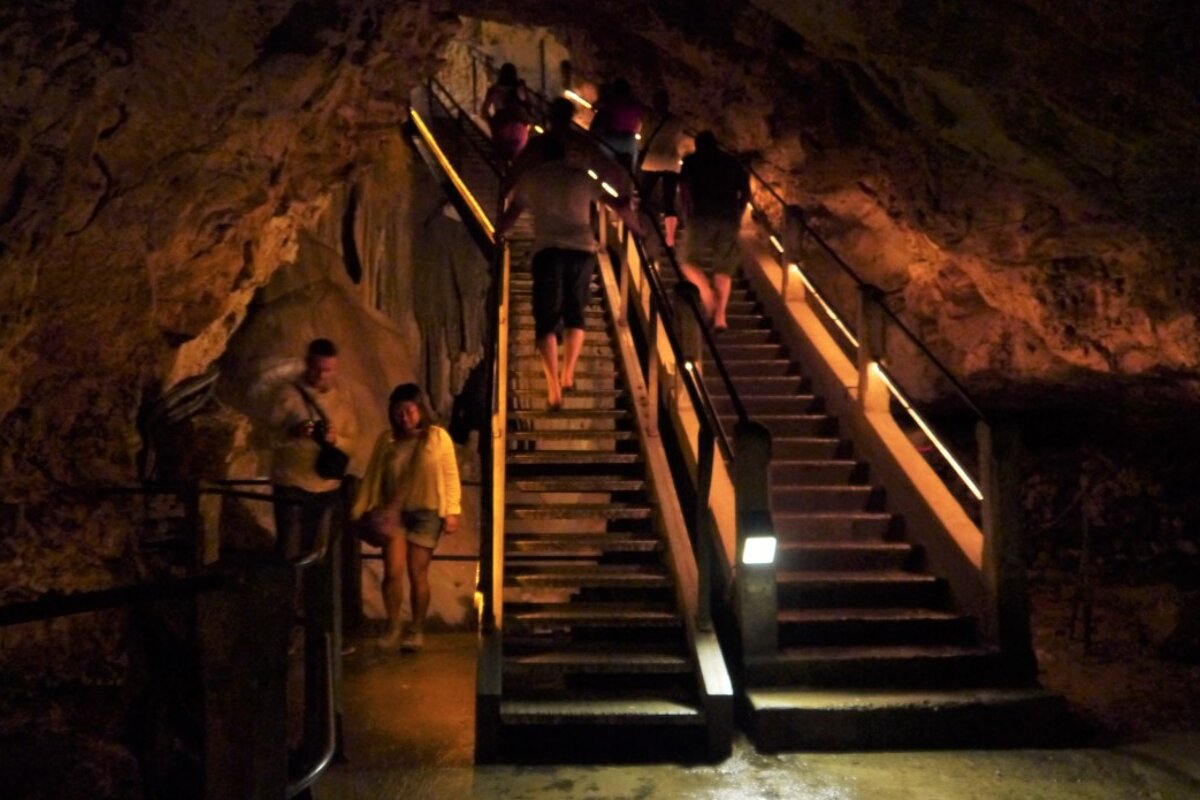 stairs leading deeper into the cave, dim lighting
