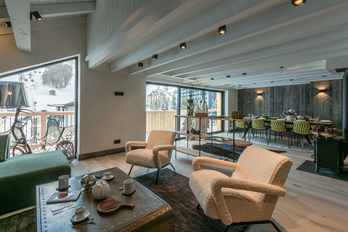 A living room with two chairs and a coffee table