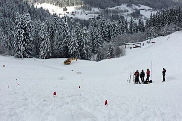 a team probing an avalanche in les gets
