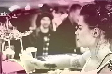 a bar person serving a drin