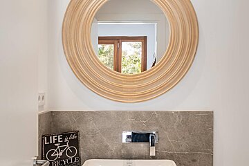 A bathroom with a sign that says life is like a bicycle