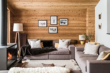 A living room with two couches and a fireplace