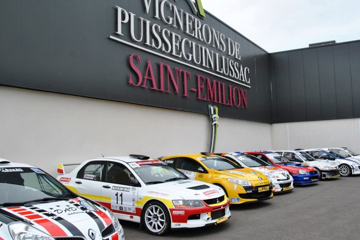 rally cars lined up in front of a winemakers