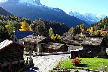 A small village with a mountain in the background