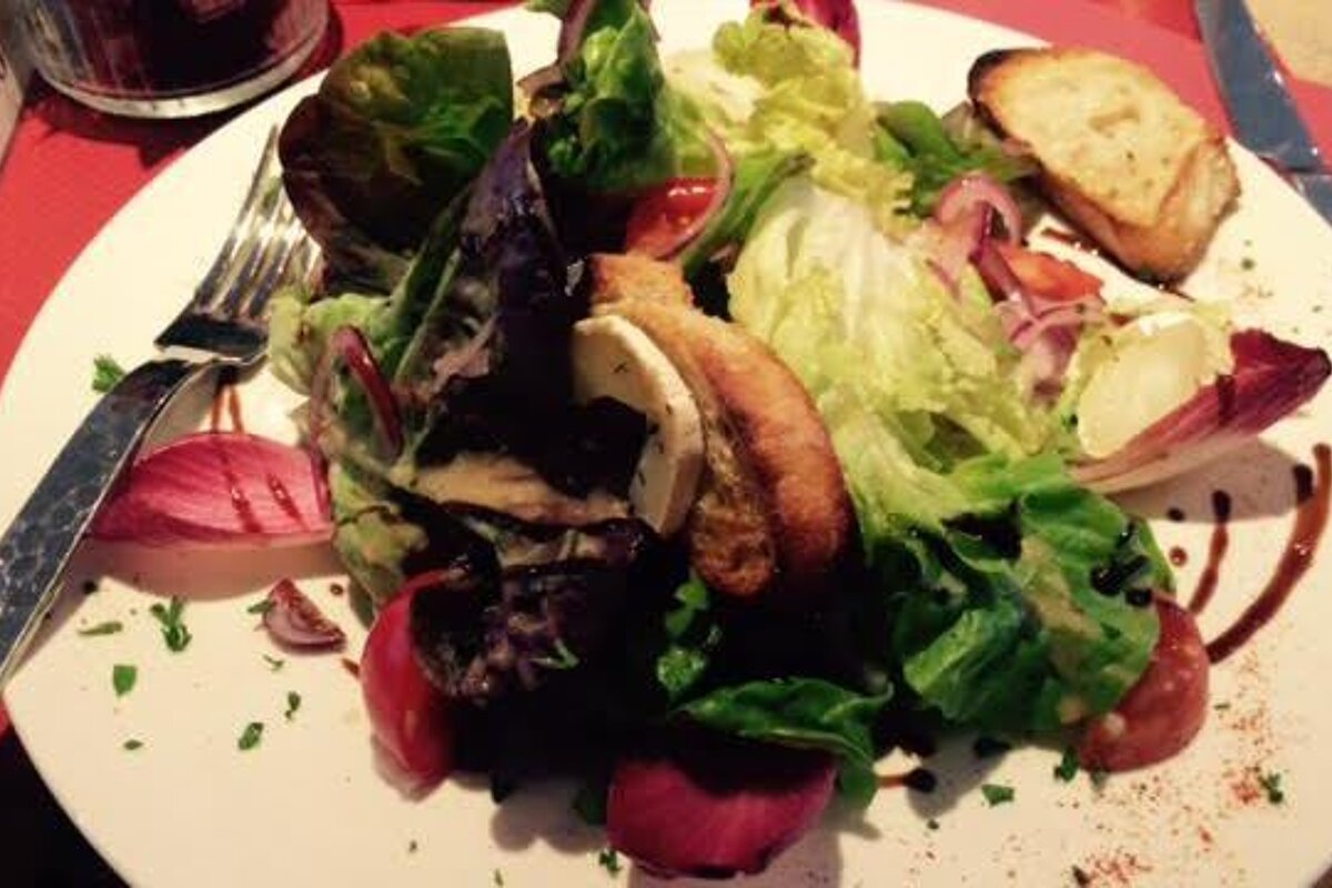 a plate of salad in a restaurant in morzine