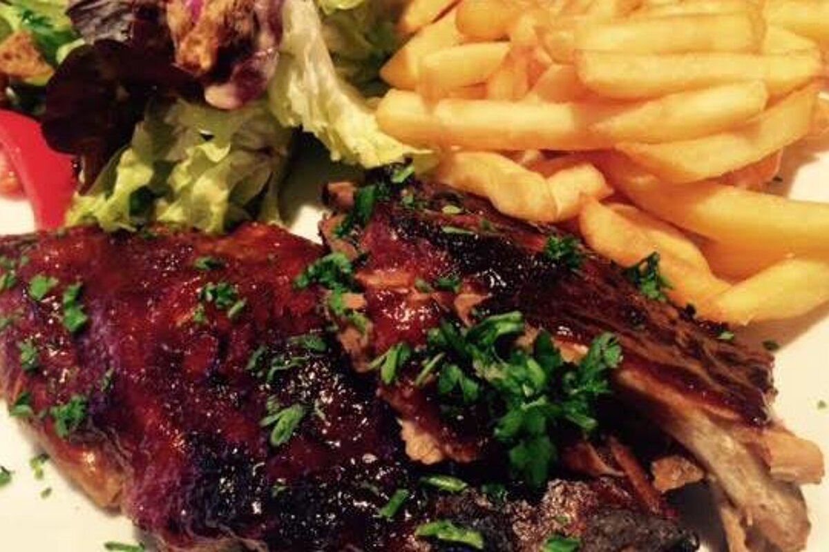 a rack of ribs and chips