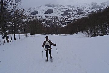 a lone person snowshoeing