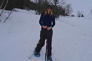 a woman snowshoeing