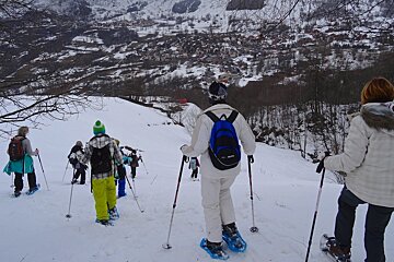 a group snow shoe walking