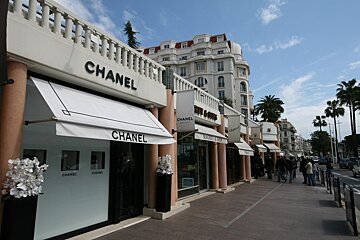 A row of chanel stores on a sunny day