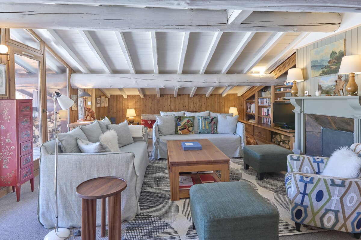 A living room filled with furniture and a fireplace