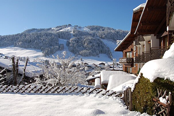 A snowy landscape with a sign that says les portes