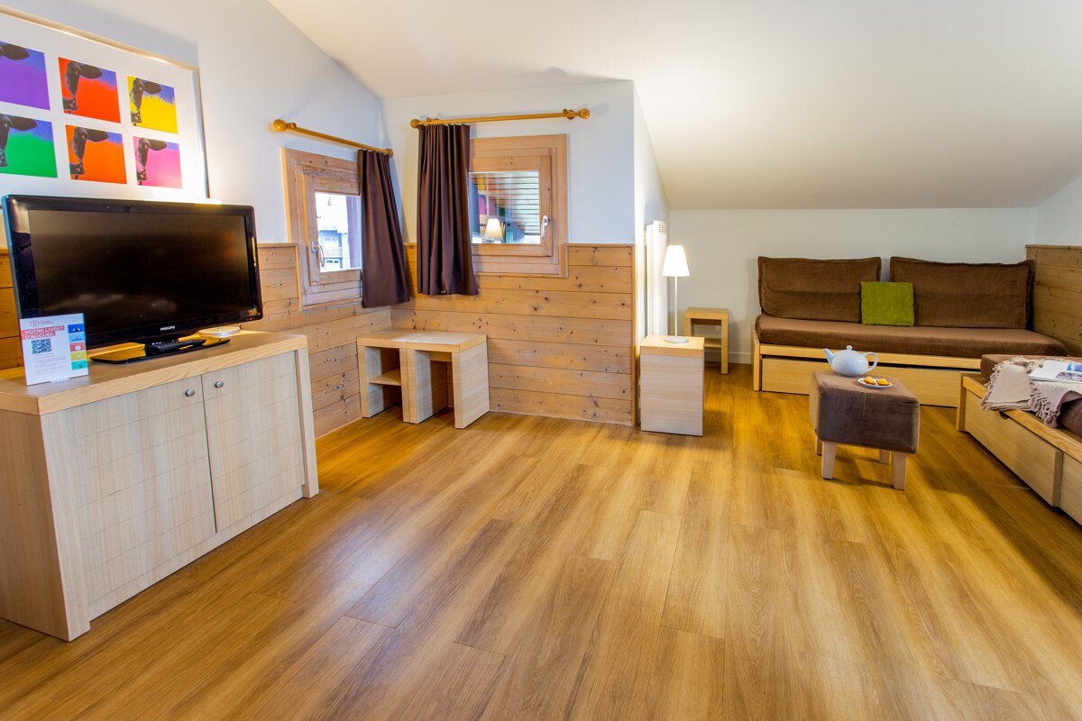 A living room with a samsung flat screen tv