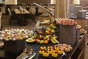 A variety of desserts and fruit on a buffet table