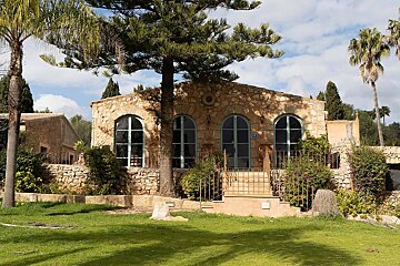 A stone building with a sign that says ' a ' on it