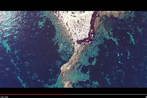 An aerial view of a coral reef in the ocean