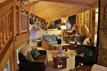 A living room filled with furniture and a bubble chair