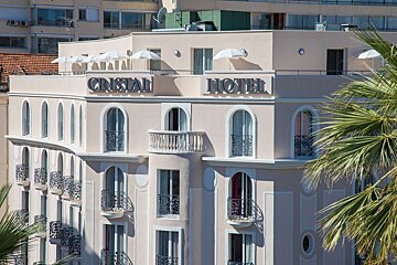 A hotel with the word cristal on the top of it