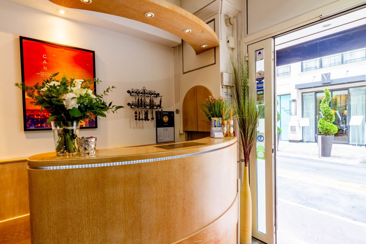 A hotel lobby with a sign that says ca on it