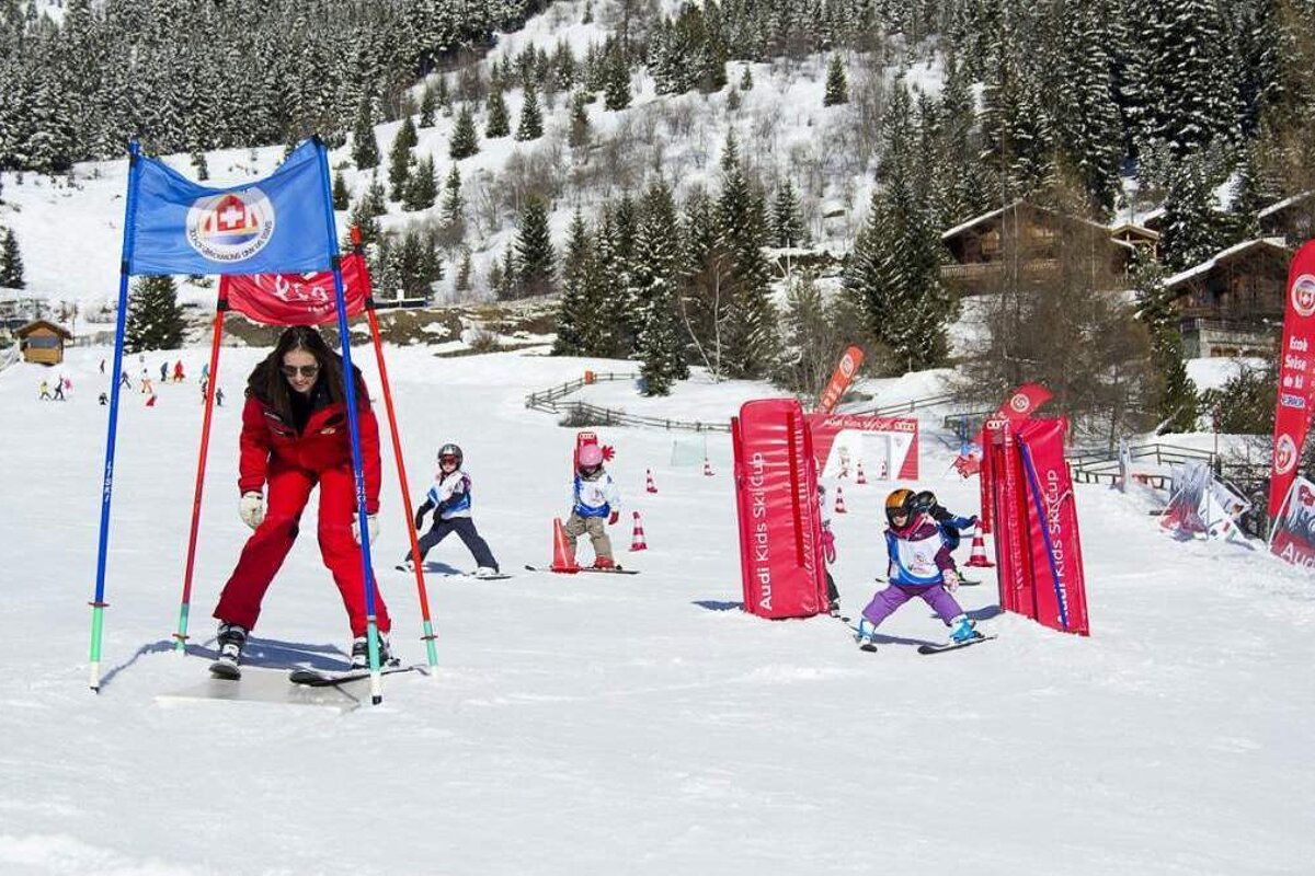 a ski instructor skiing under a flag
