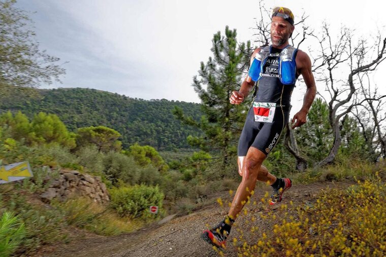 A trail runner in the mountains of Sospel