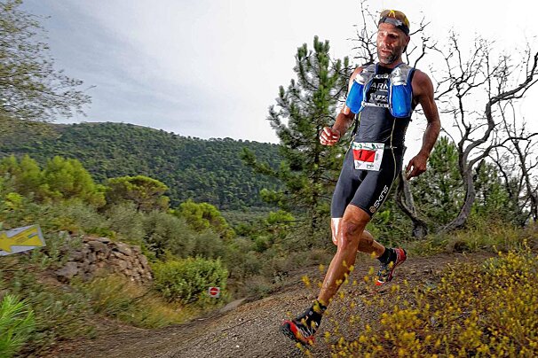 A trail runner in the mountains of Sospel