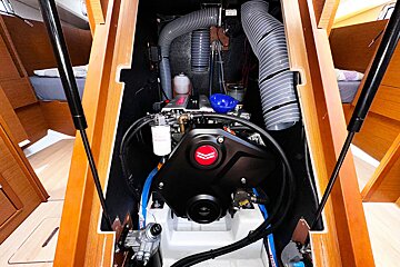 A black engine with a red arrow pointing to the right
