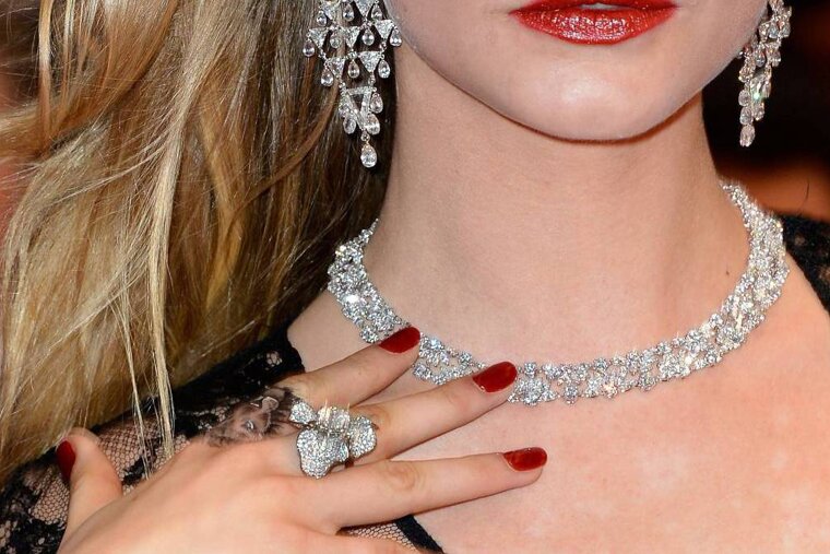 a picture of matching diamond, necklace, earrings adn ring