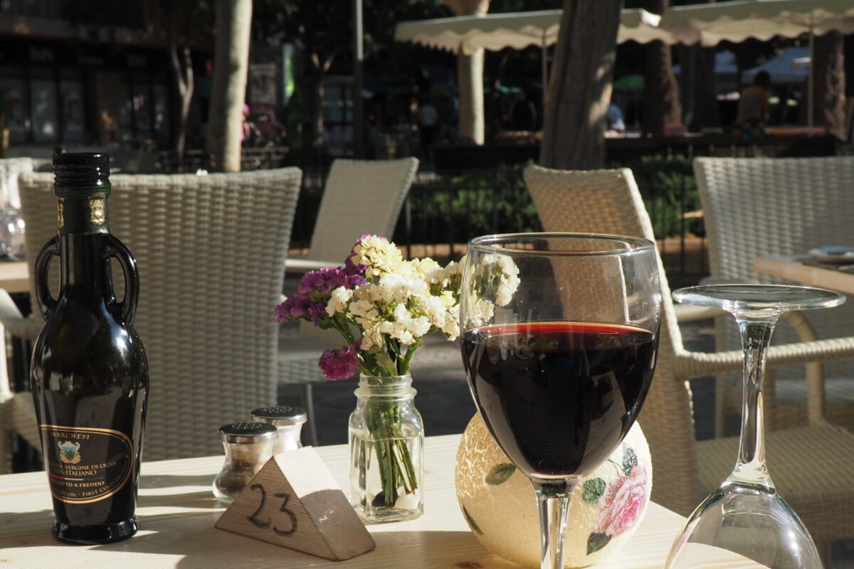 a glass of red wine at a restaurant in mallorca