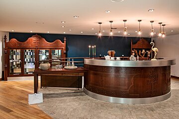 A round wooden counter with the word ritual on it