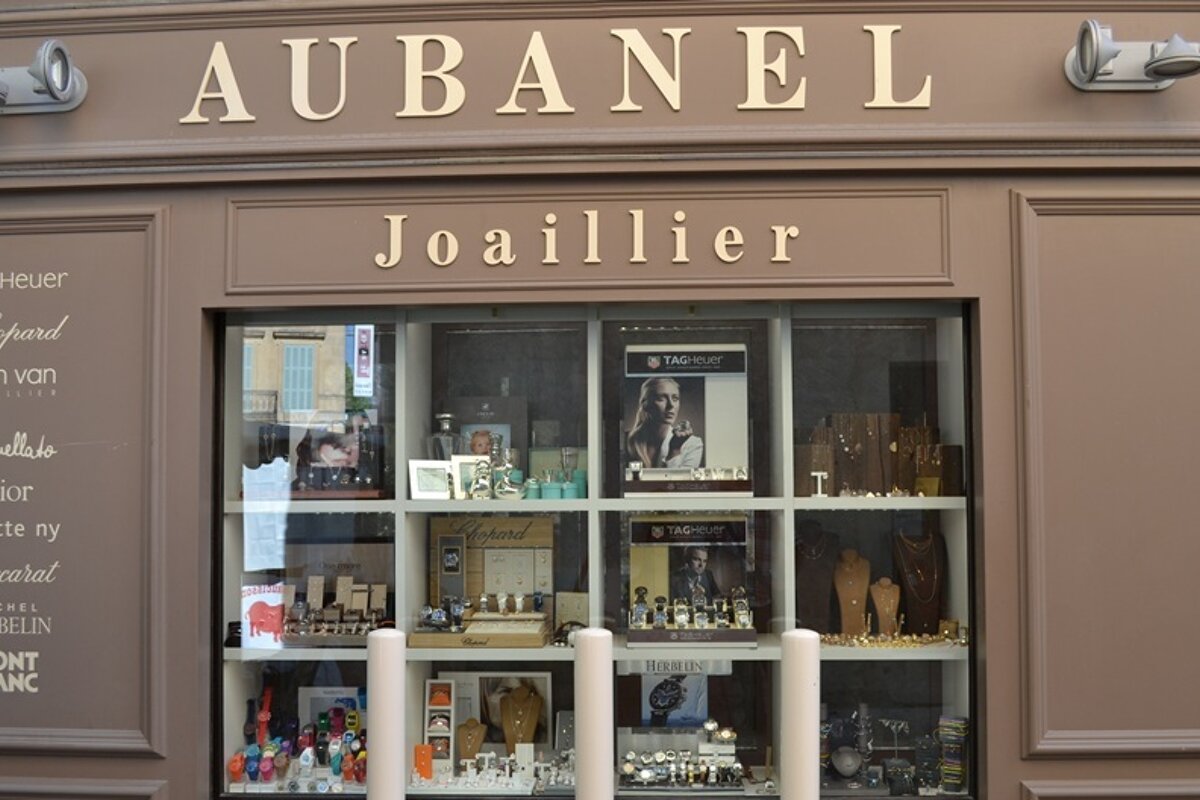 A store front for aubanel joaillier with a display of watches