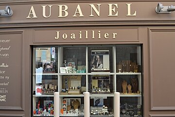 A store front for aubanel joaillier with a display of watches