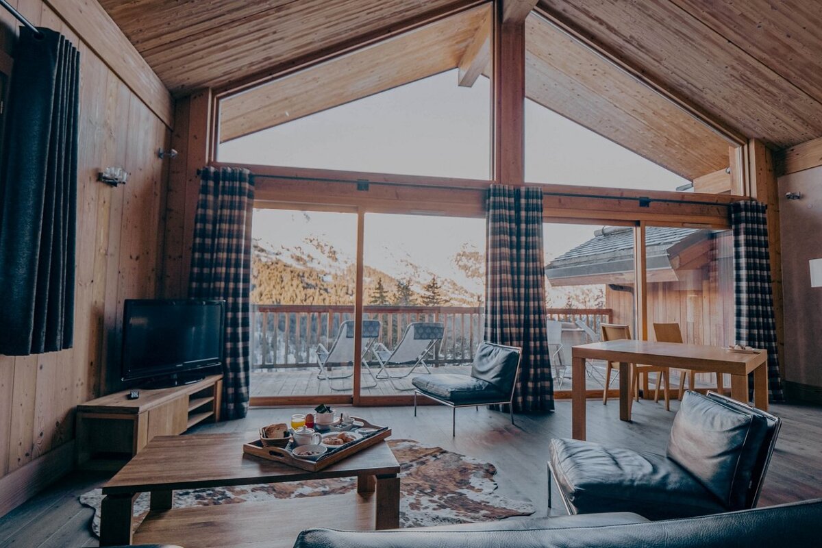 A living room with a tray of food on the table
