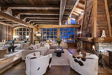 A living room filled with furniture and a fireplace