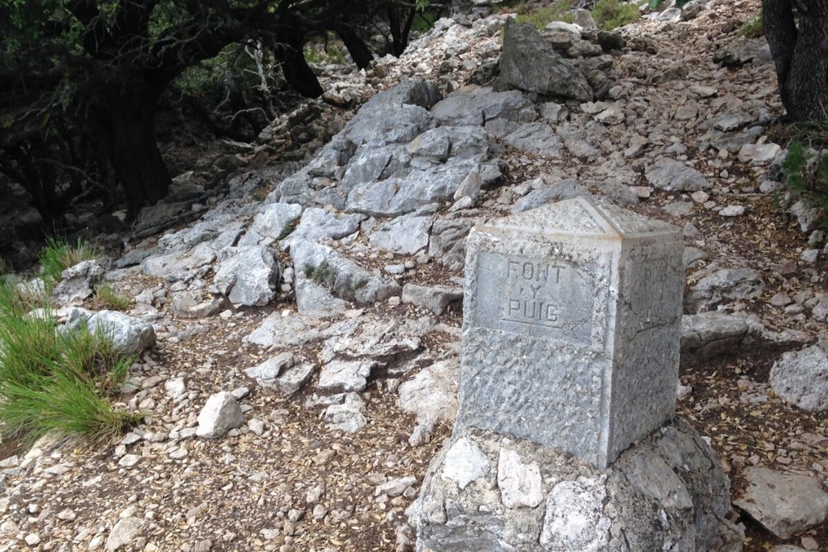 A stone way marker on a path in mallorca