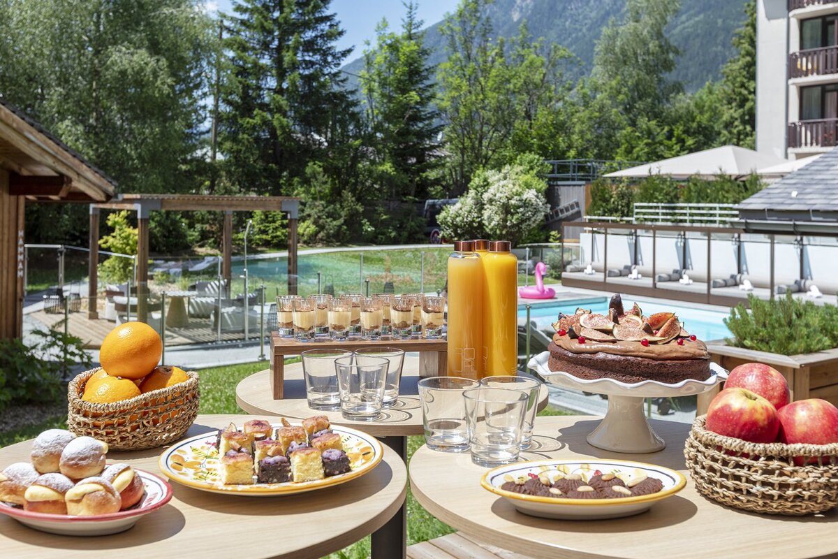 A table with a variety of desserts and drinks on it