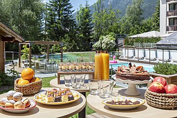 A table with a variety of desserts and drinks on it
