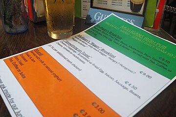 a drinks menu coloured with the irish flag colours