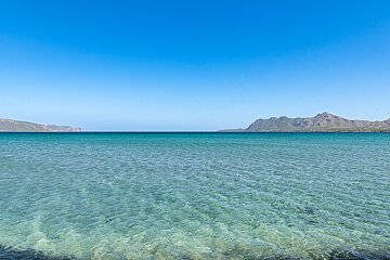 A large body of water with mountains in the background