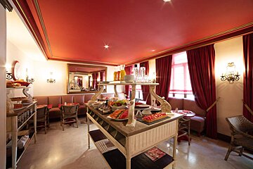 A room with a red ceiling and red curtains