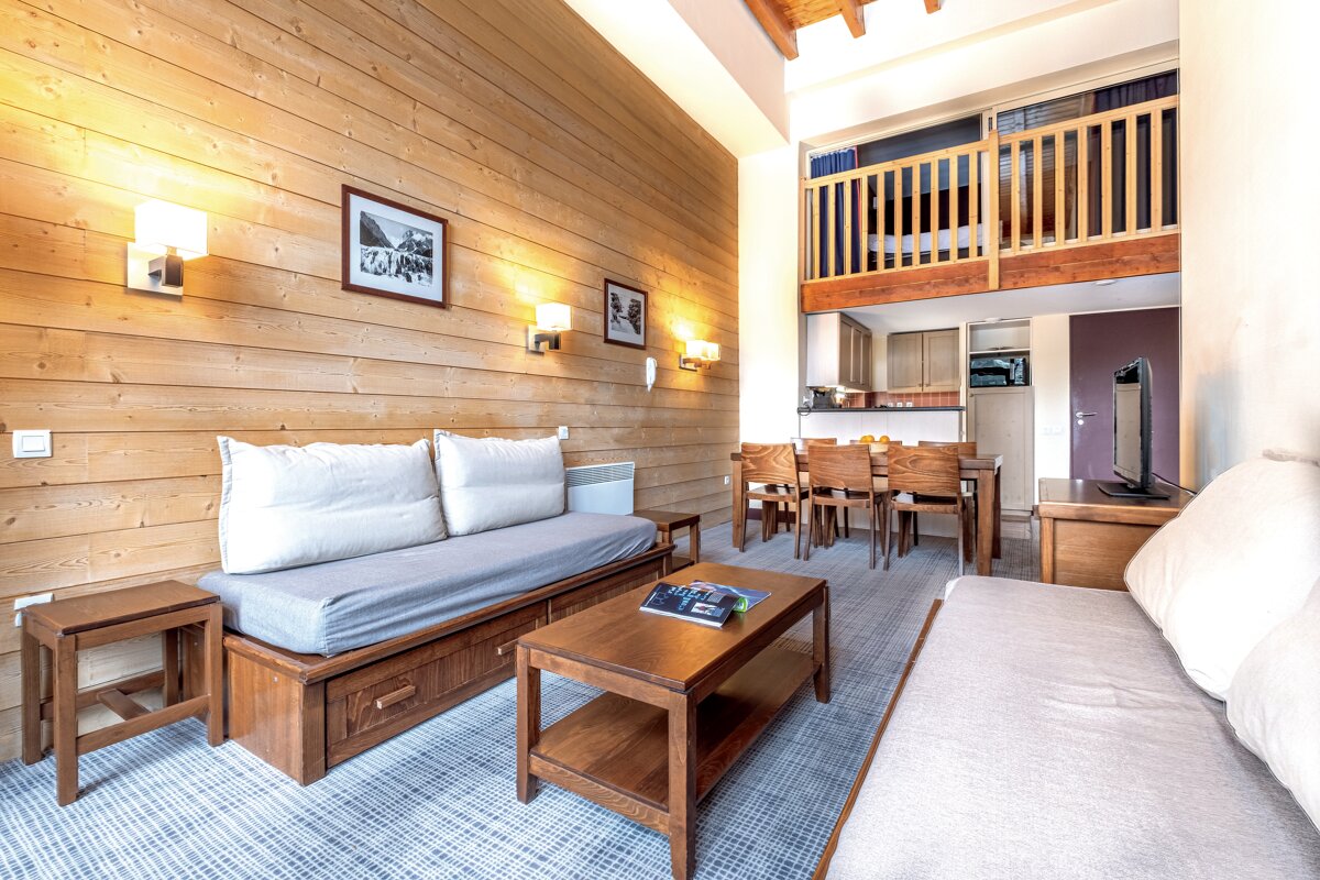 A living room with a couch and a coffee table