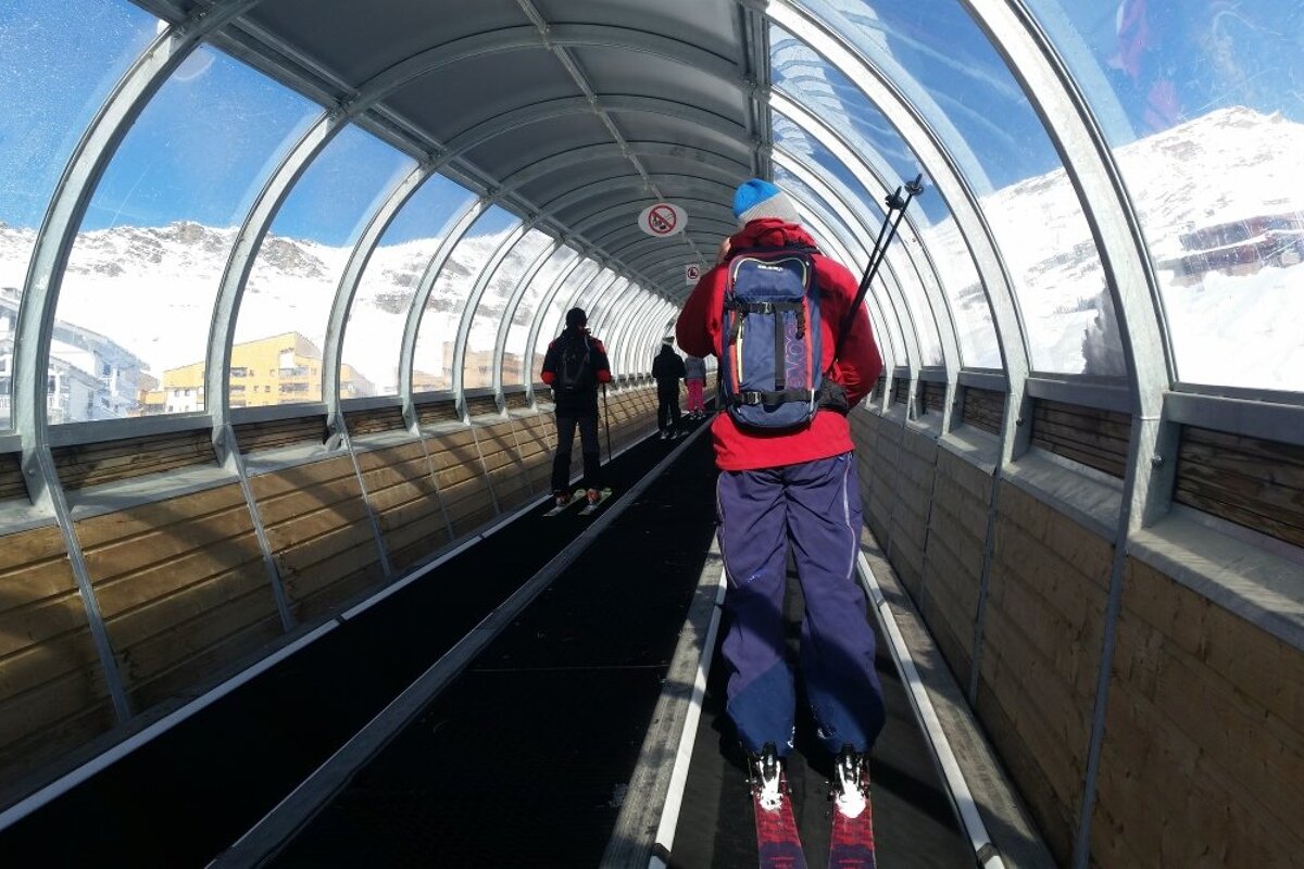 skiers in a tunnel