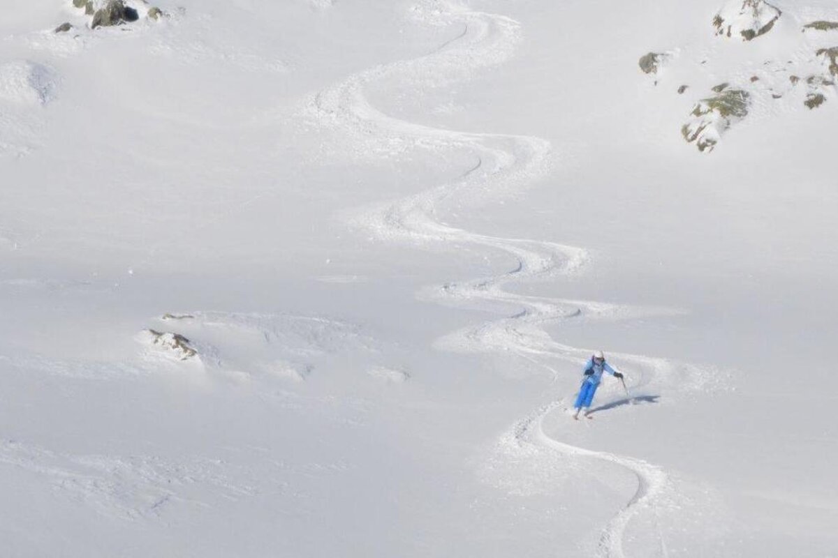 a skier in fresh off piste snow