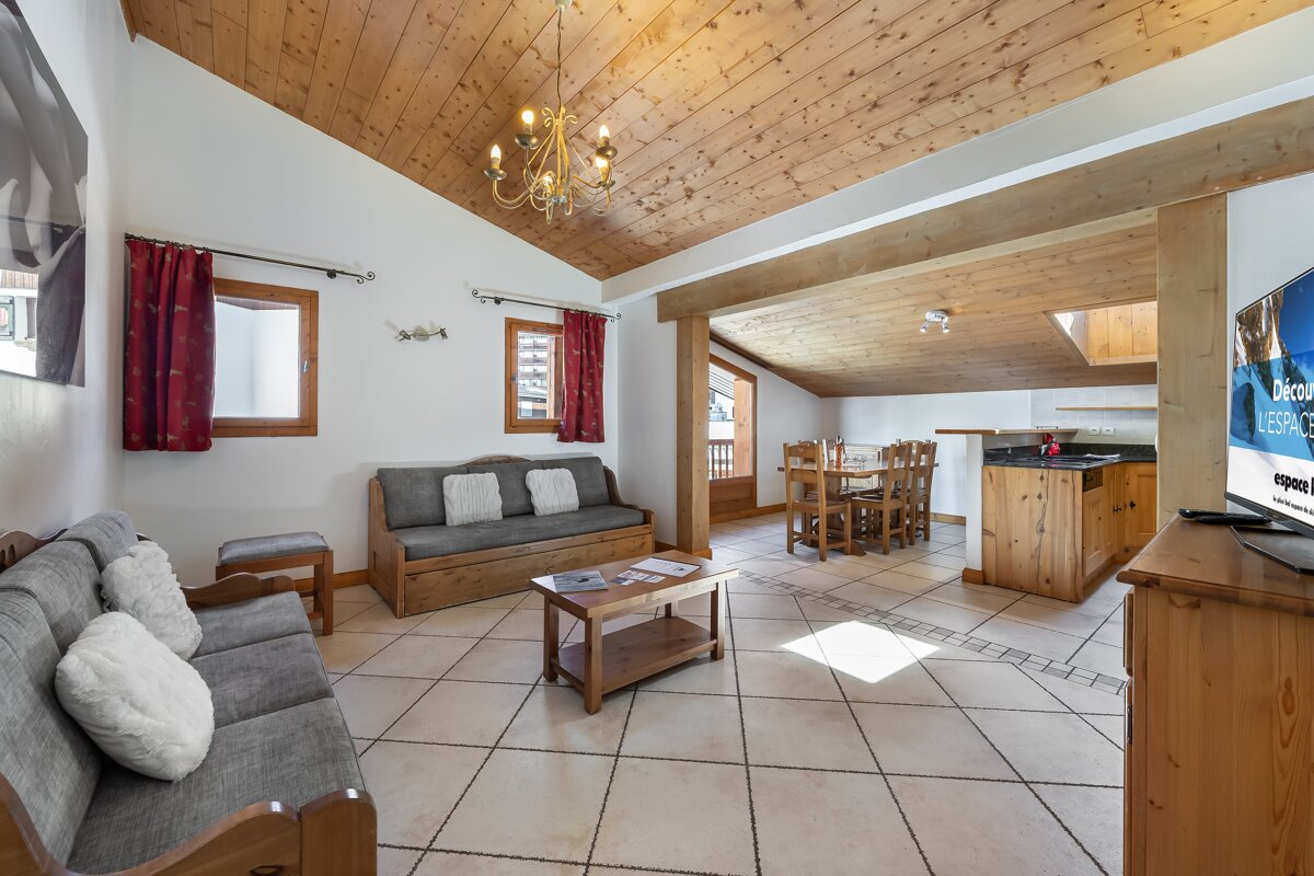 A living room with a couch and a flat screen tv